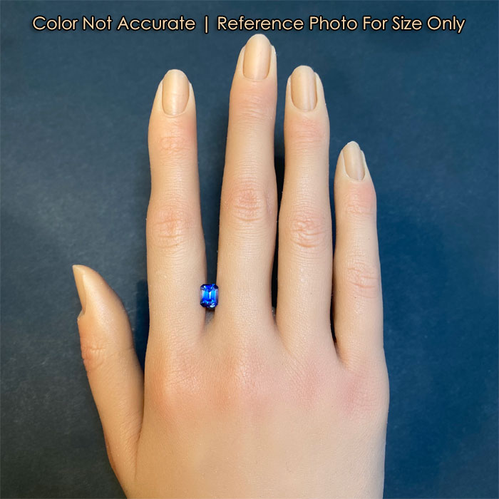 bicolor sapphire gemstone on hand