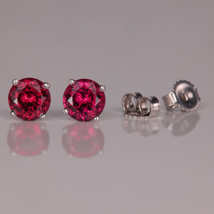 red violet garnet gemstone earrings in white gold