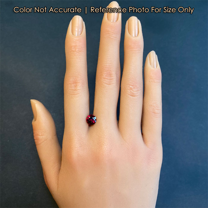 pyrope gemstone on hand round brilliant cut