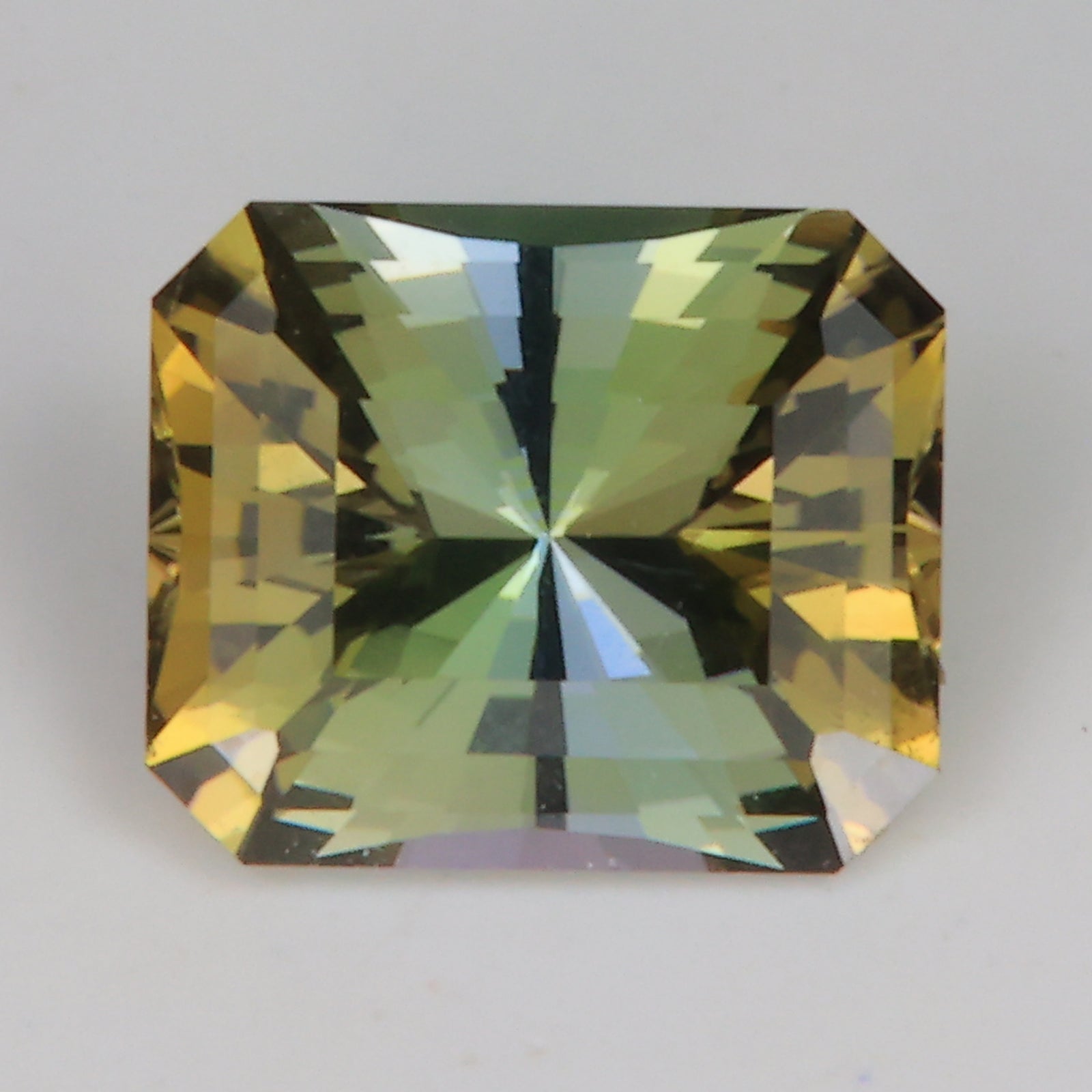 brilliant style emerald cut zoisite tanzanite green yellow blue
