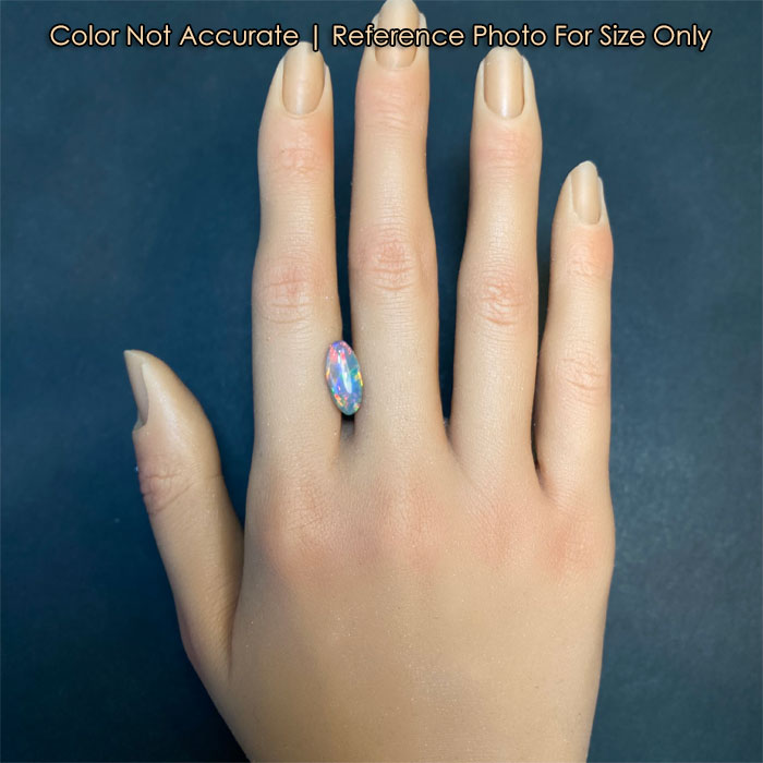 oval opal gemstone on a hand