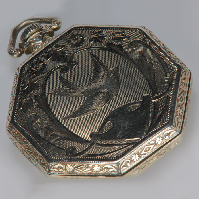 swallow motif on back of white gold Waltham pocket watch