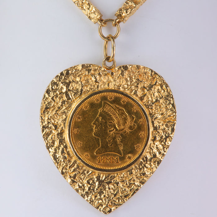 yellow gold necklace with a .48oz 24k gold coin
