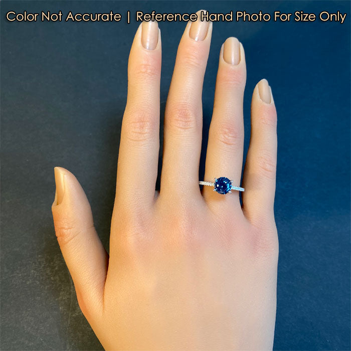 sapphire gemstone ring with diamonds on hand