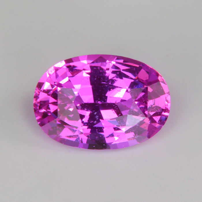 vivid pink oval cut sapphire gemstone