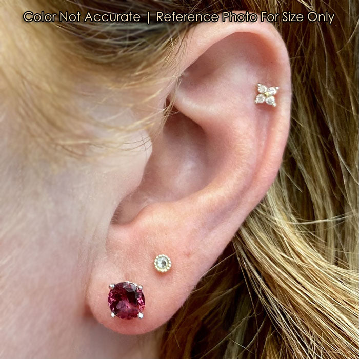 red violet color rhodolite garnet earrings on ear
