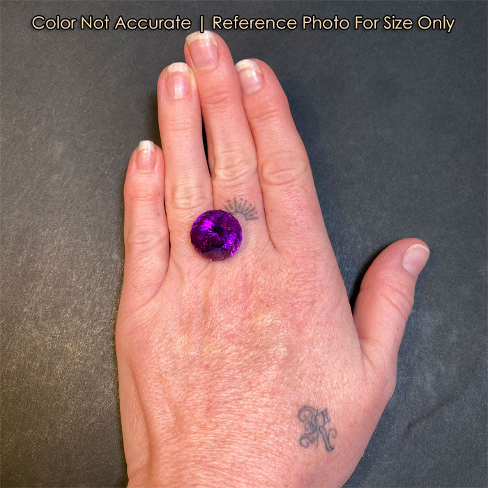 amethyst gemstone on hand round natural color