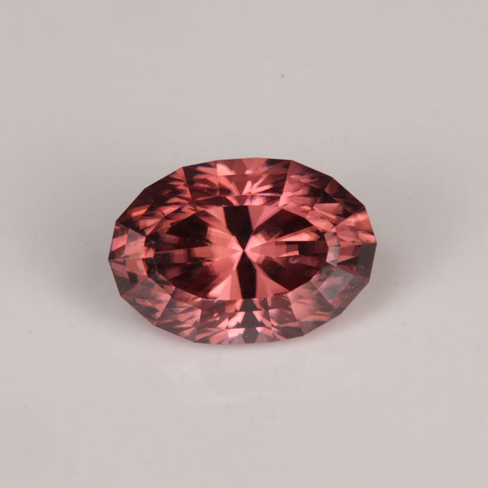 brownish peachy pink oval cut imperial zircon gemstone