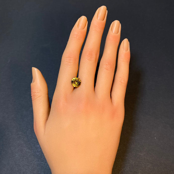 brownish yellow round brilliant mali garnet