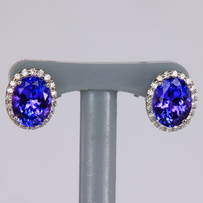 oval cut tanzanite gemstone earrings with diamond halo