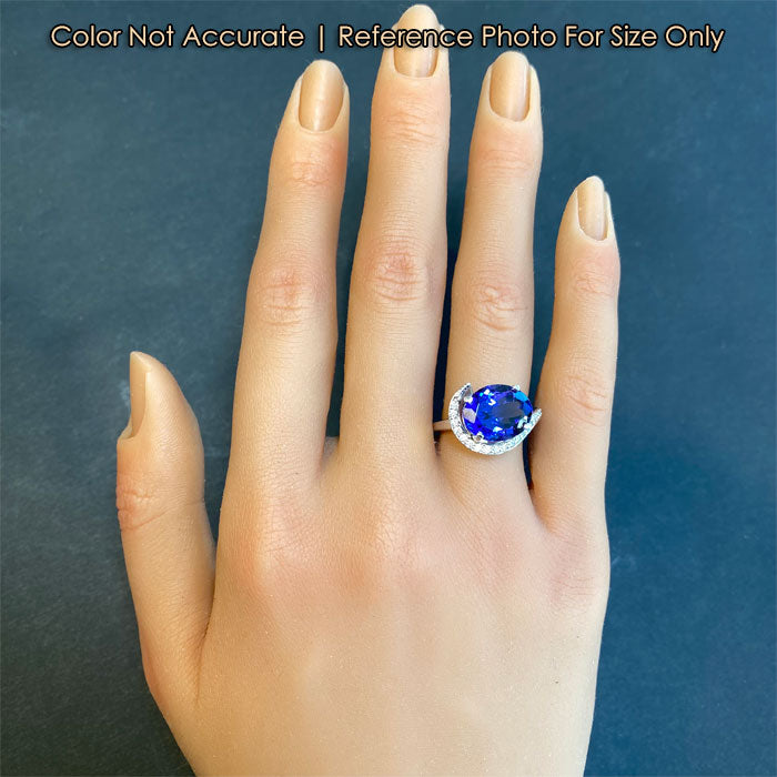 size of oval tanzanite and diamond ring to hand