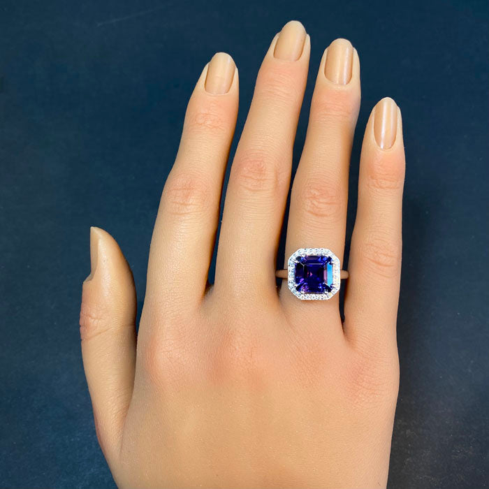 white gold and tanzanite ring with diamonds on hand