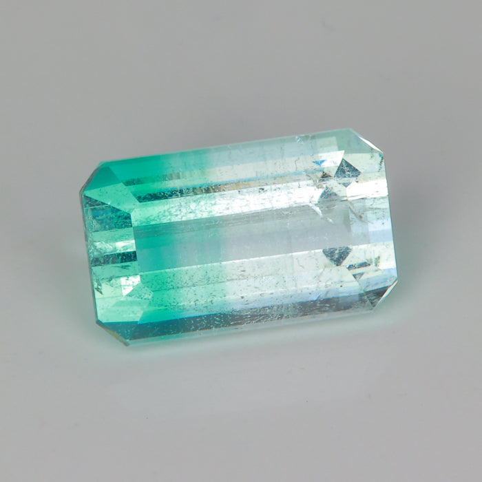 emerald cut emerald banded beryl gemstone