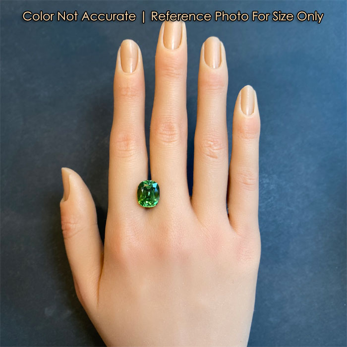 antique cushion cut tourmaline on hand