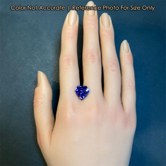 natural blue violet tanzanite on hand