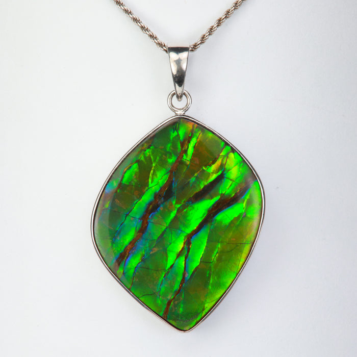 green blue orange ammolite gem pendant in silver