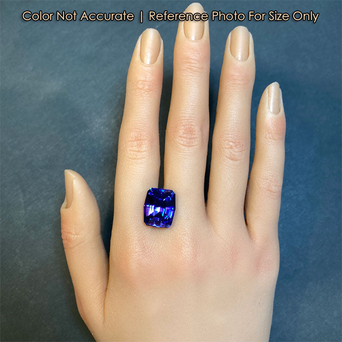 violet blue red flash tanzanite gem on hand