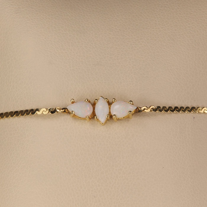 yellow gold serpentine bracelet with australian opals