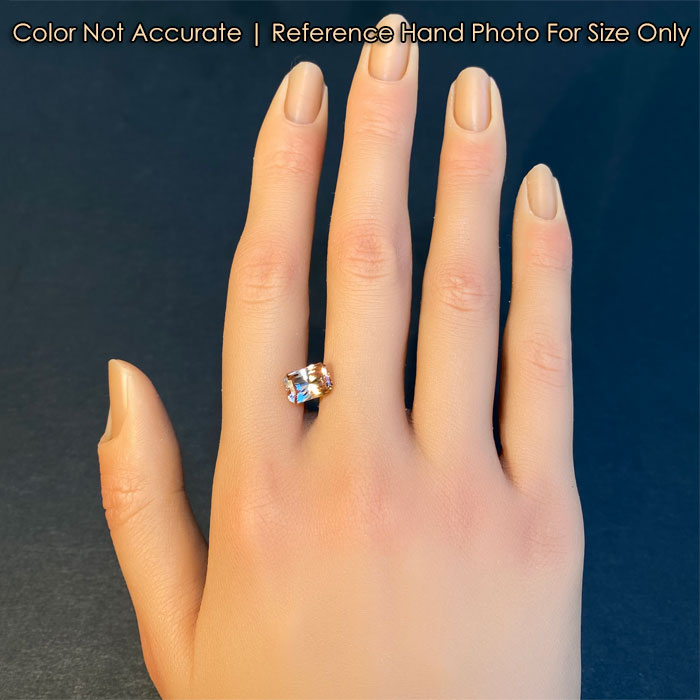 pink orange fancy tanzanite gemstone on hand