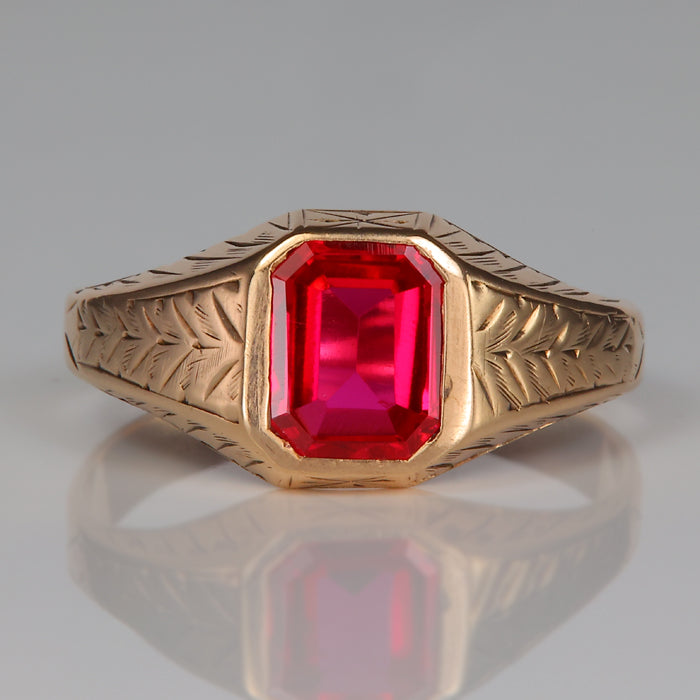yellow gold synthetic ruby bezel ring