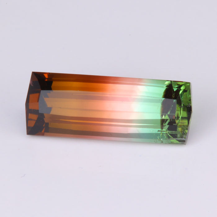 emerald cut bicolor tourmaline gemstone brownish pink green