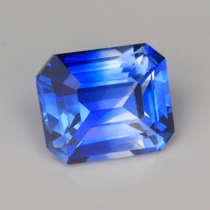 emerald cut blue and clear sapphire gemstone