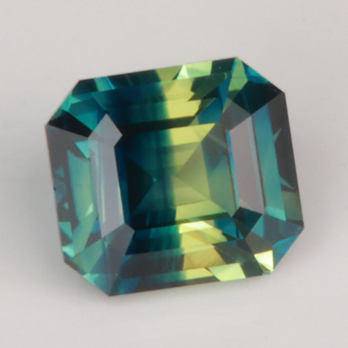 emerald cut blue yellow bicolor sapphire gemstone