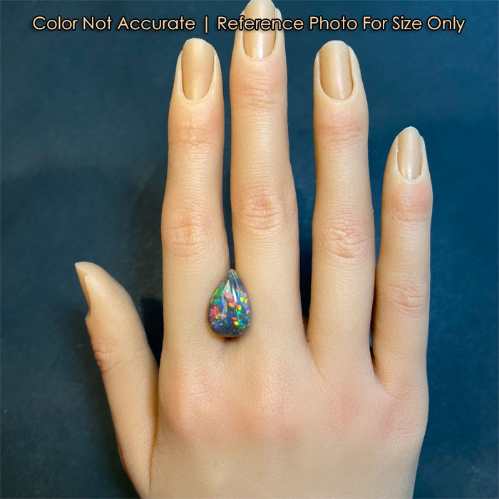 pear shape black opal on hand for size