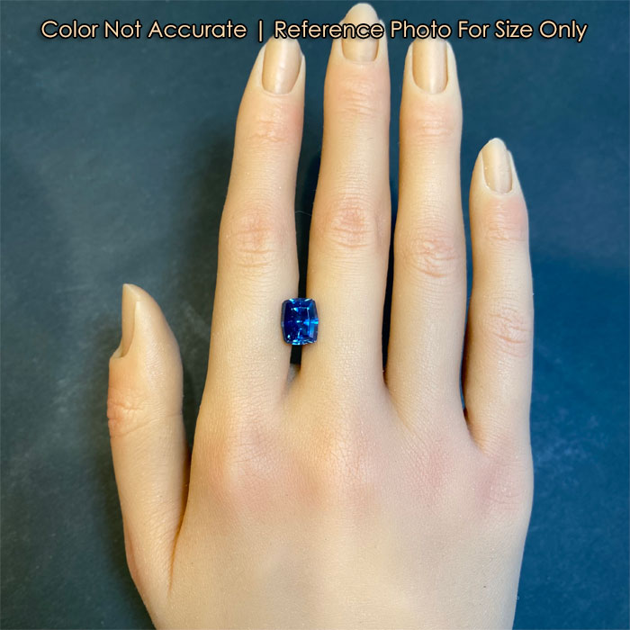 size to hand of a blue sapphire gemstone