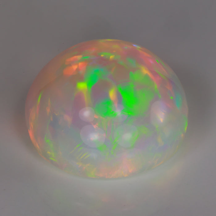 rainbow opal gemstone round cabochon