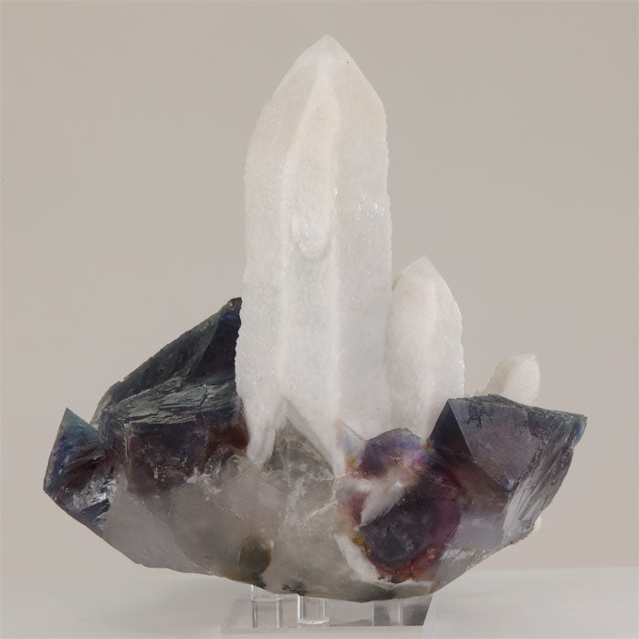 white quartz crystal on fluorite