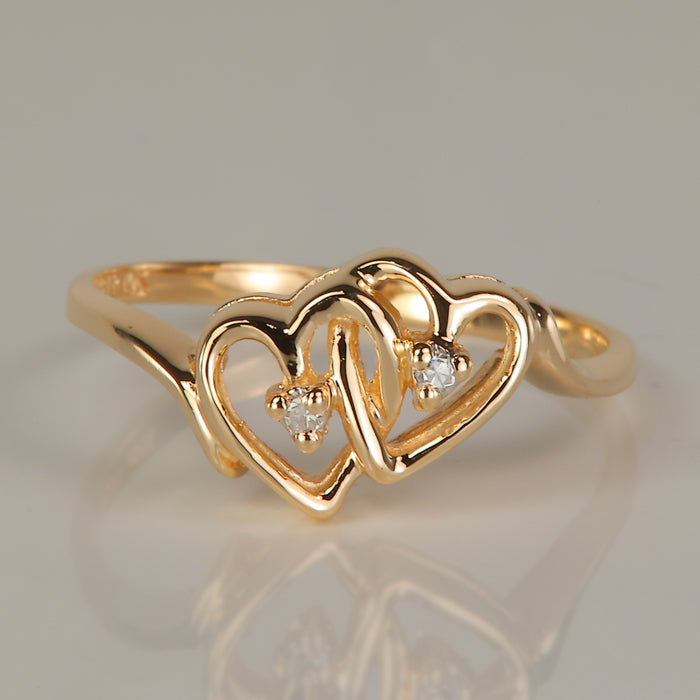 yellow gold double hearts ring with diamond accents