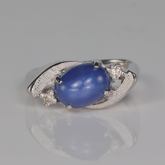 synthetic star sapphire ring in white gold with diamond accents