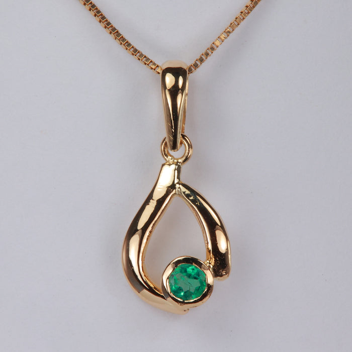 yellow gold emerald pendant bezel set