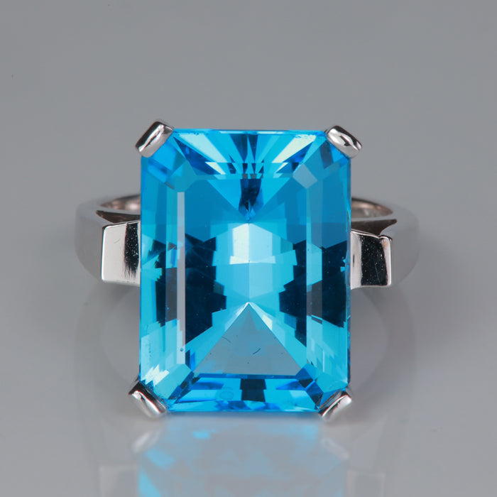 swiss blue topaz gemstone ring in white gold emerald cut