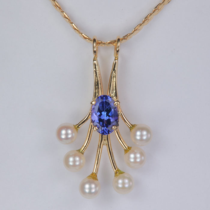 yellow gold c link necklace with oval tanzanite gemstone and freshwater pearls