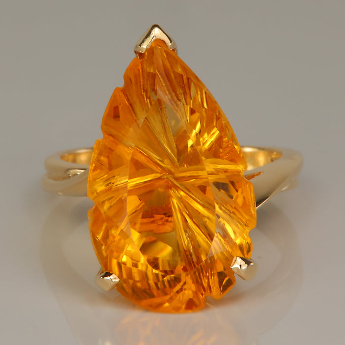Golden orange pear shape fantasy cut ring in yellow gold