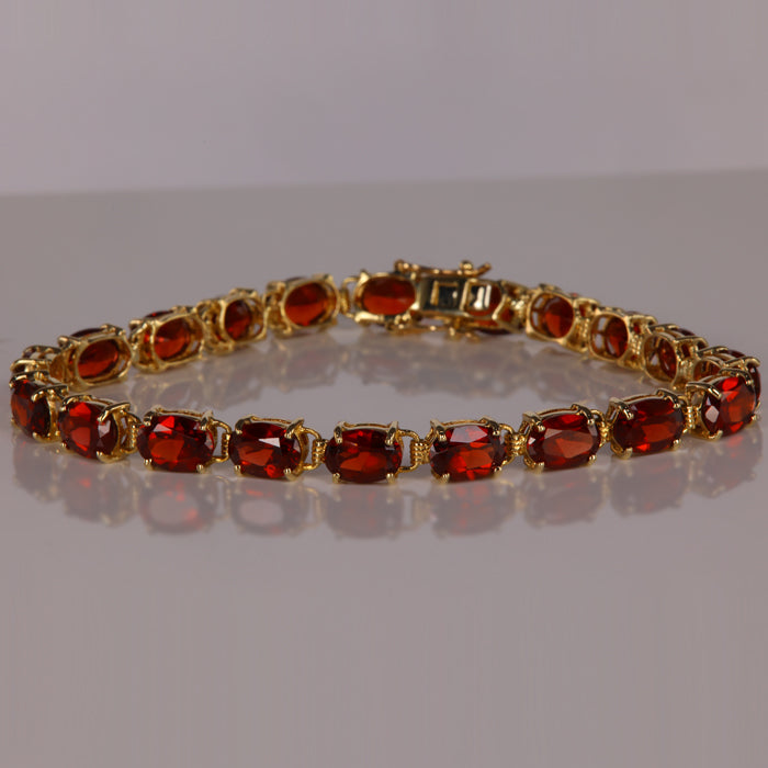 garnet gemstone bracelet in yellow gold