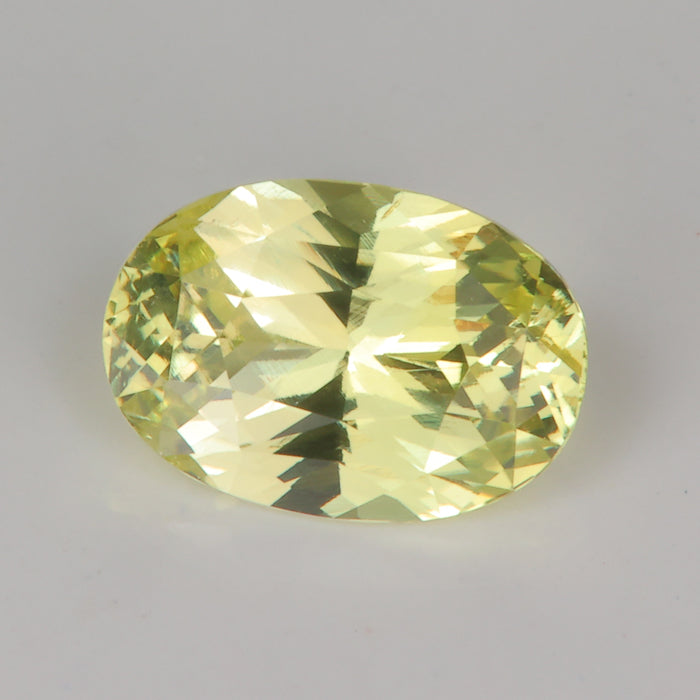 Oval cut greenish yellow natural sapphire gemstone