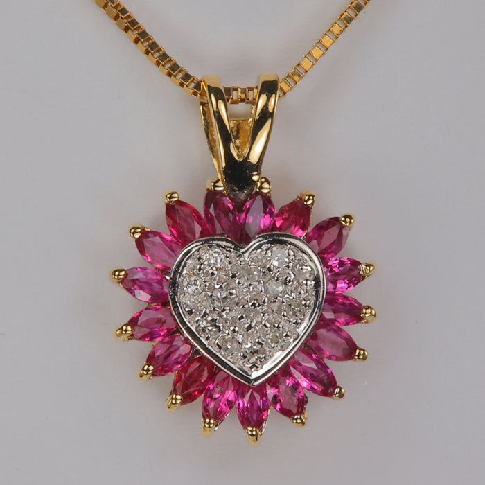 gold pendant with ruby and diamond accents heart shape