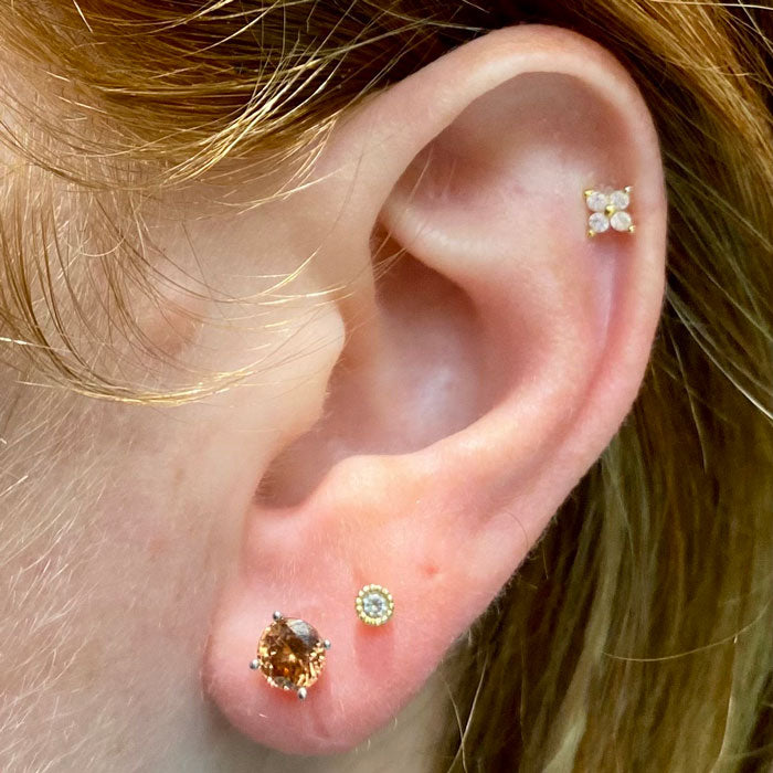 zircon studs on ear