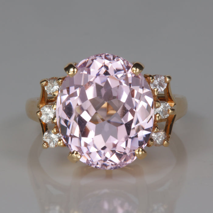 oval cut purplish pink kunzite gemstone ring with white sapphires in yellow gold