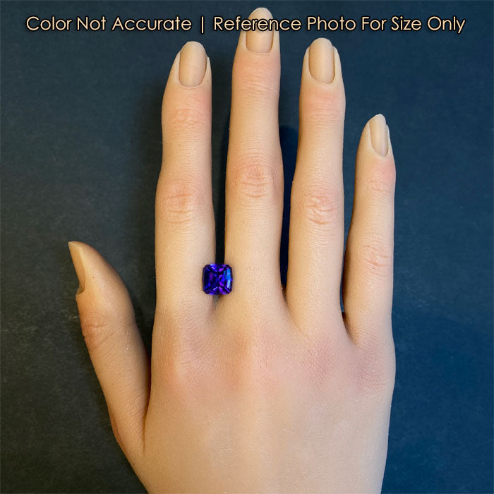 tanzanite rare gem on hand for size