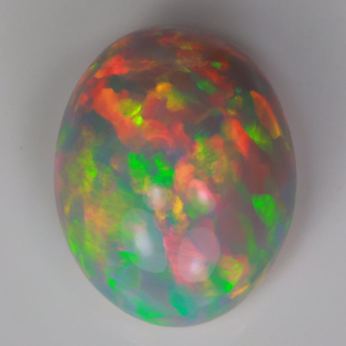 Oval cabochon semi black opal