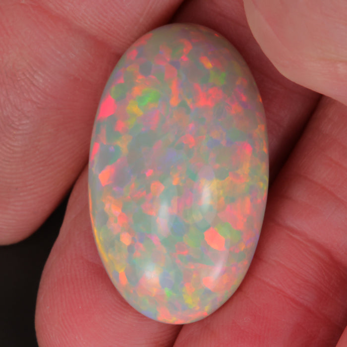 opal gemstone in hand