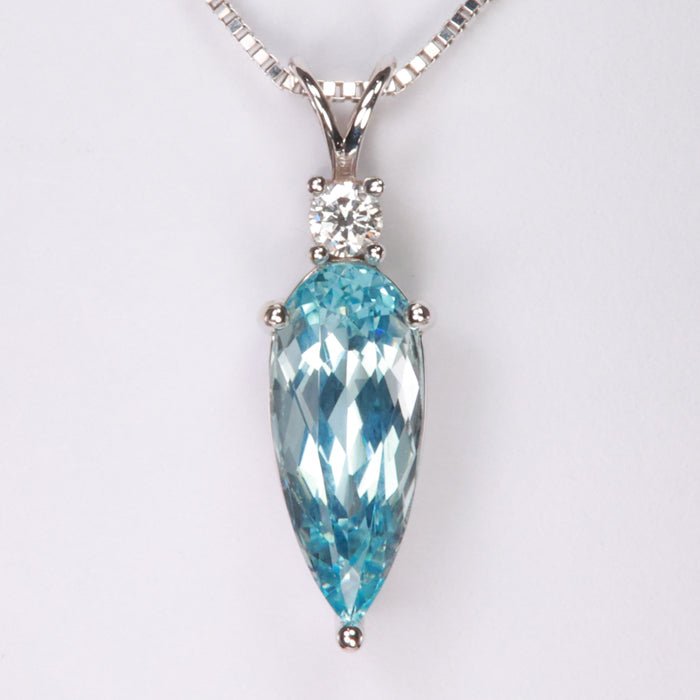 greenish blue pear shape brilliant gemstone pendant in white gold with diamond accent