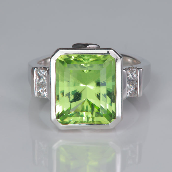mint green peridot estate ring with diamonds set in white gold
