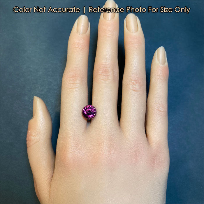 pink violet round portuguese garnet gem on hand