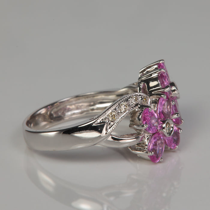 estate ring in white gold with pink sapphire and diamond flowers