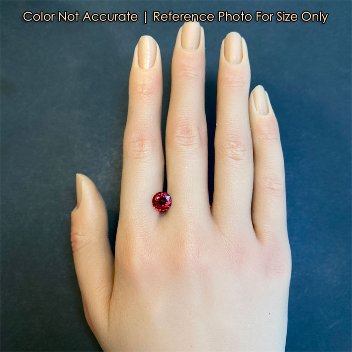 round brilliant red spinel gem size to hand